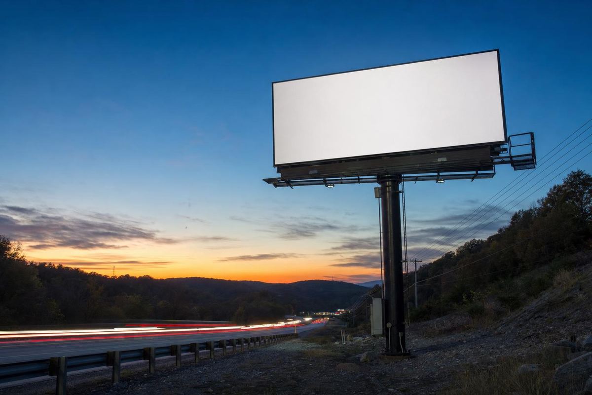 Blank digital billboard beside a highway at dusk, the kind used for digital billboard advertising in Springfield, MO