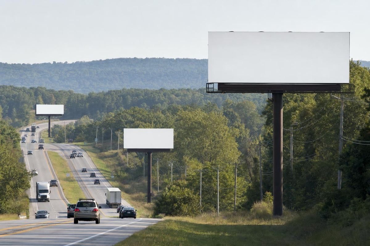 Billboards lining a highway corridor, illustrating how many billboards are in Springfield, MO